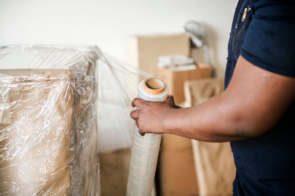 Black man moving furniture